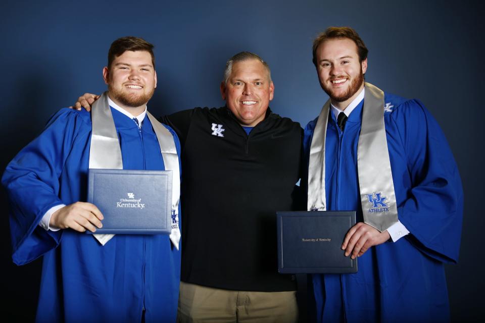 Former Kentucky offensive lineman Drake Jackson (left), offensive line coach John Schlarman and offensive lineman Luke Fortner (right) pose for photo following graduation in 2019.