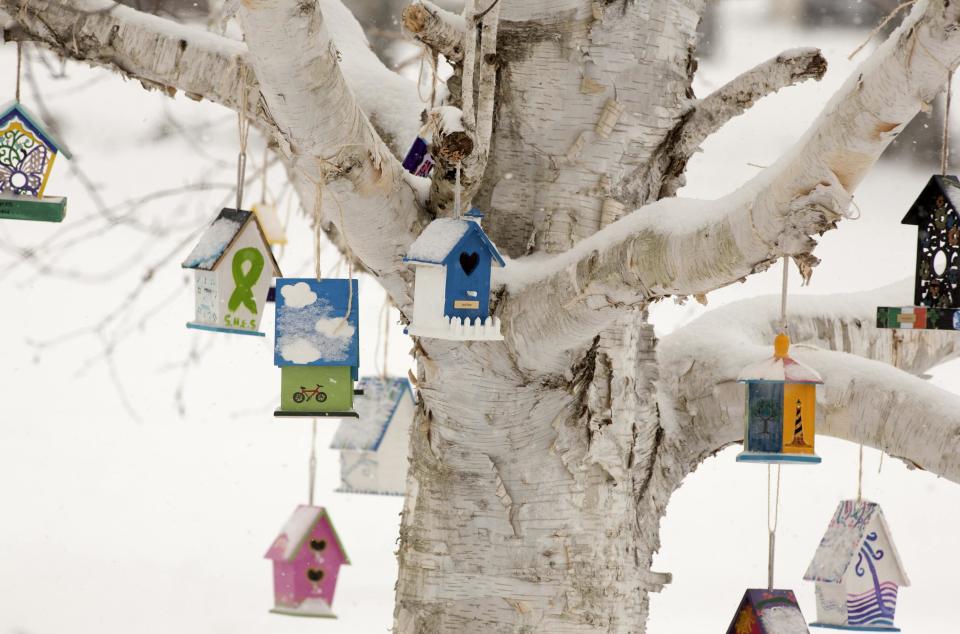 Personalized birdhouses are part of a memorial for the victims of the Sandy Hook Elementary School shooting in Newtown