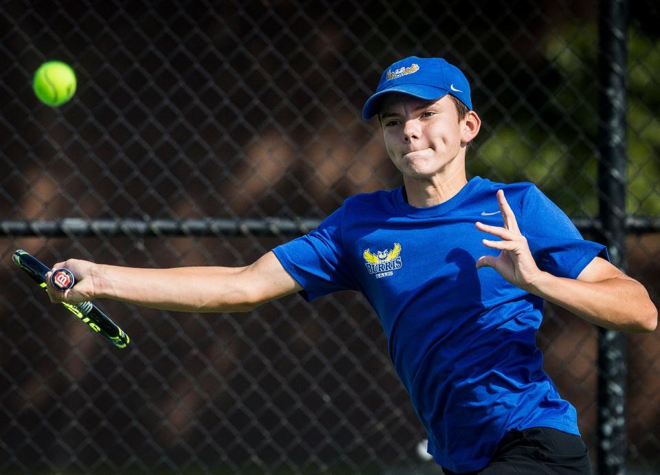 Burris' Charlie Behrman tracks down a ball during the No. 1 singles sectional championship match against Delta at Delta High School Saturday, Oct. 3, 2020.