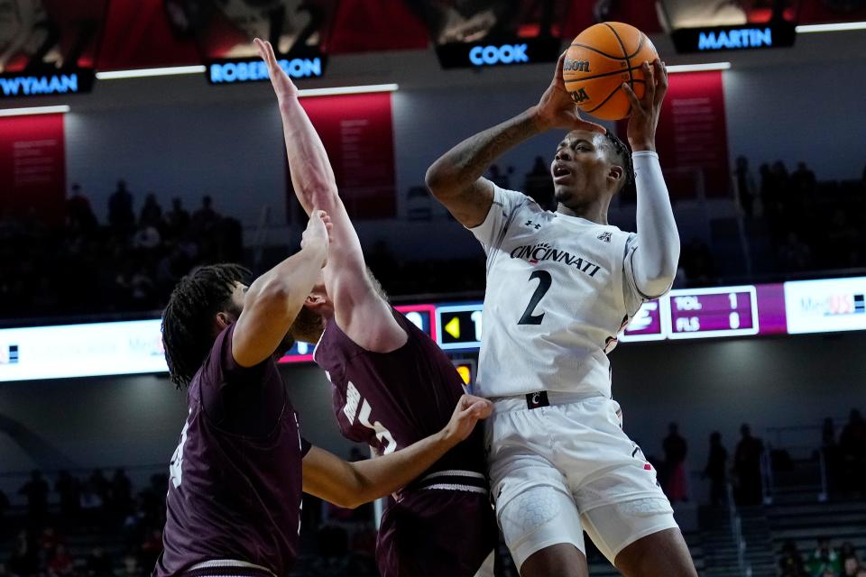 Bearcats guard Landers Nolley II  rises to shoot in the second half of  Sunday's game. Nolley had a strong all-around game with 14 points, five rebounds, three assists, one steal and one blocked shot.