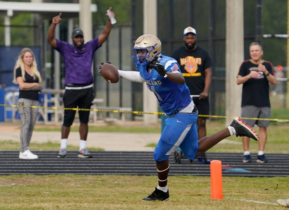 Mainland's LJ McCray scores the a touchdown during the spring football jamboree at Mainland High School, Thursday, May 19, 2022.