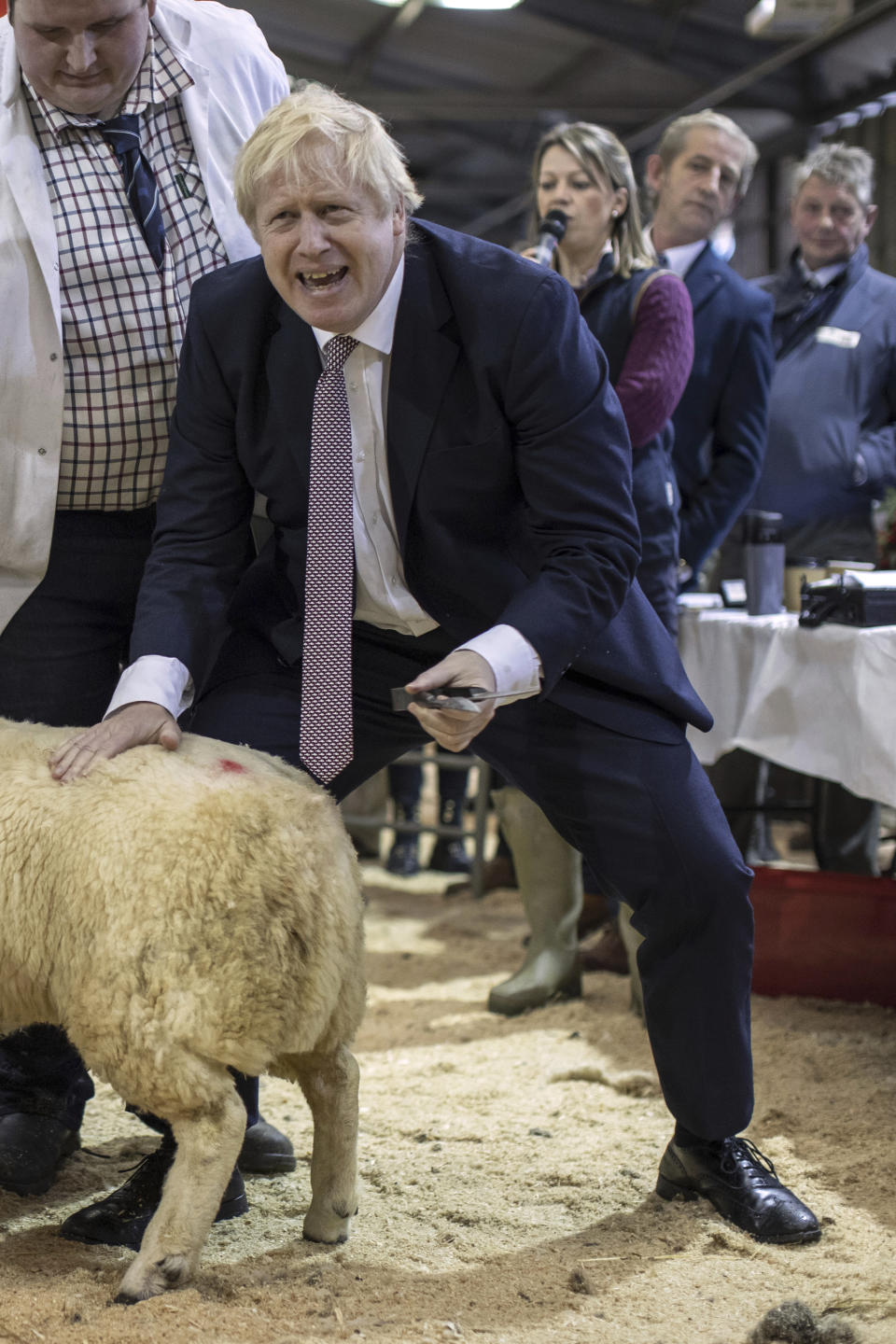 Britain's Prime Minister Boris Johnson visits the Welsh County Show in Llanelwedd, Wales, Monday Nov. 25, 2019. Boris Johnson’s party is campaigning heavily on a promise to “get Brexit done” by taking Britain out of the European Union on the scheduled date of Jan. 31, if it wins the Dec.12, election. (Dan Kitwood/Pool via AP)