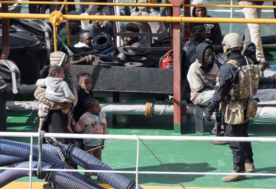 Armed forces stand onboard the Turkish oil tanker El Hiblu 1, which was hijacked by migrants, in Valletta, Malta, Thursday March 28, 2019. A Maltese special operations team on Thursday boarded a tanker that had been hijacked by migrants rescued at sea, and returned control to the captain, before escorting it to a Maltese port. (AP Photo/Rene' Rossignaud)