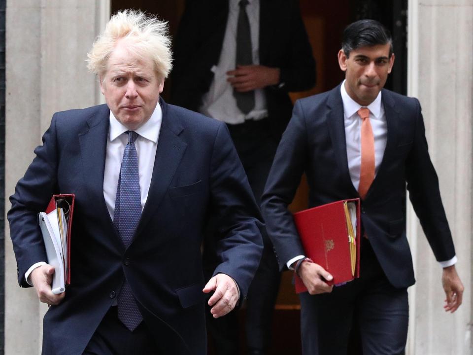 The prime minister, Boris Johnson, left, and the chancellor, Rishi Sunak, leave 10 Downing Street ( Jonathan Brady/PA)