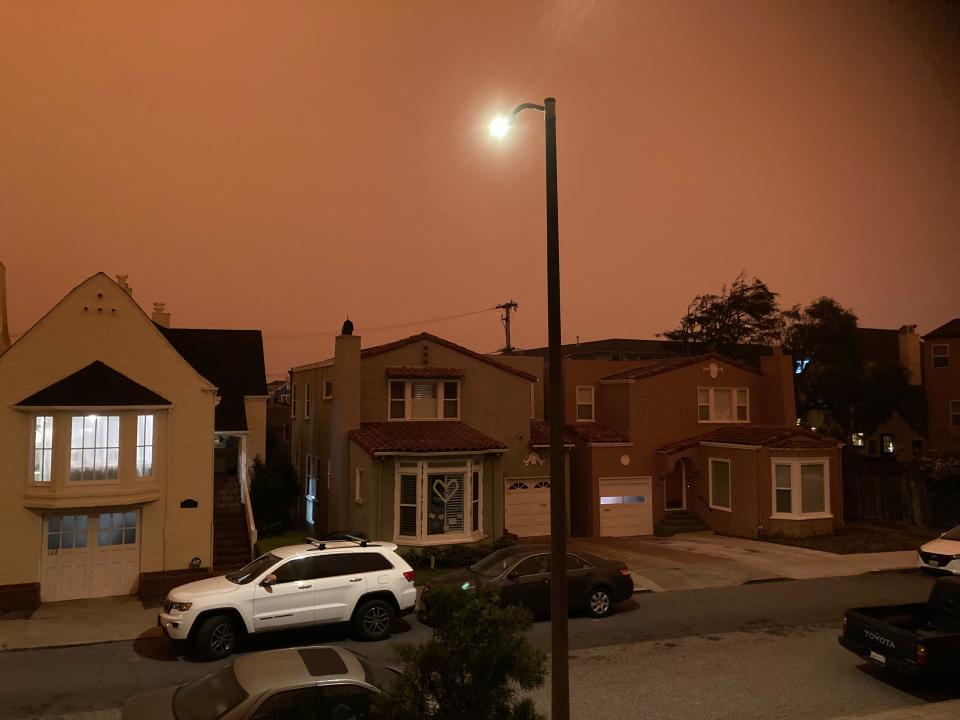 At 11:17 a.m. in San Francisco on Wednesday, street and house lights were on as smoke from fires burning  throughout California darkened the skies.