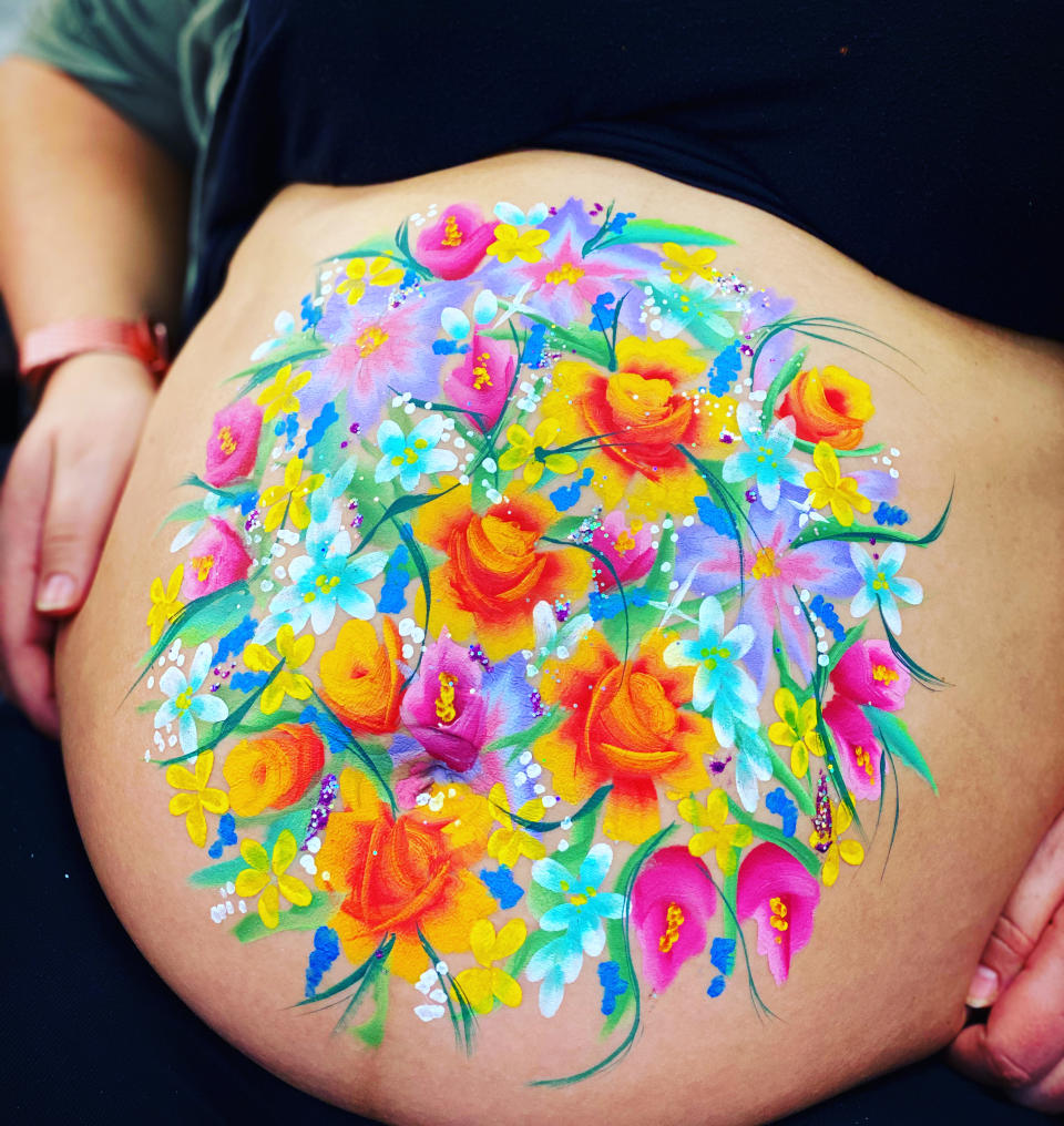 The make-up artist creates intricate art on baby bumps. (Jo Peters)