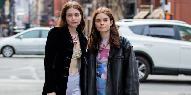 two sisters walk down the street at new york fashion week to illustrate a guide to the best gifts for sisters 2023