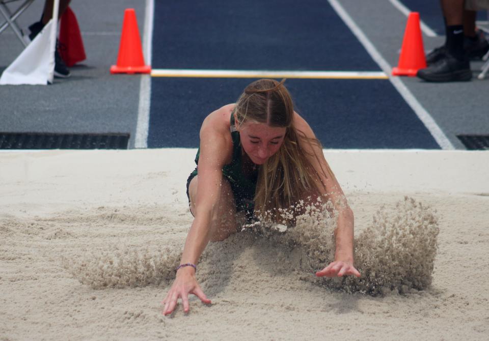 Sasha Gregory of Nease lands during the girls long jump  at the FHSAA Class 4A high school track and field state championship in Jacksonville on May 20, 2023. [Clayton Freeman/Florida Times-Union]