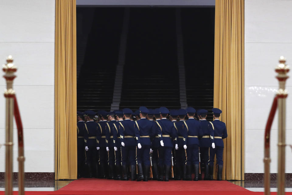 Members of an honor guard leave the hall after a welcome ceremony held by Chinese Premier Li Keqiang for visiting Israeli Prime Minister Benjamin at the Great Hall of the People in Beijing, Monday, March 20, 2017. (AP Photo/Andy Wong)