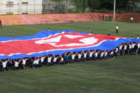 <p>In this Sept. 26, 2017, photo, a student flag team practices a performance waving red, white and blue banners to form th North Korea national flag at a Tokyo Korean high school in Tokyo. Many third- and fourth-generation descendants of Koreans brought to Japan during the imperialist years before and during World War II remain loyal to their roots. Families send children to private schools that favor North Korea and teach the language, culture and history of their ancestry. Despite recent North Korean missile launches and nuclear tests, students say they take pride and view their community as a haven from the discrimination they face from ethnic Japanese. (AP Photo/Eugene Hoshiko) </p>