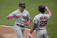 Boston Red Sox's Hunter Renfroe, left, celebrates his home run with Bobby Dalbec (29) during the eighth inning of a baseball game against the Baltimore Orioles, Sunday, May 9, 2021, in Baltimore. (AP Photo/Nick Wass)