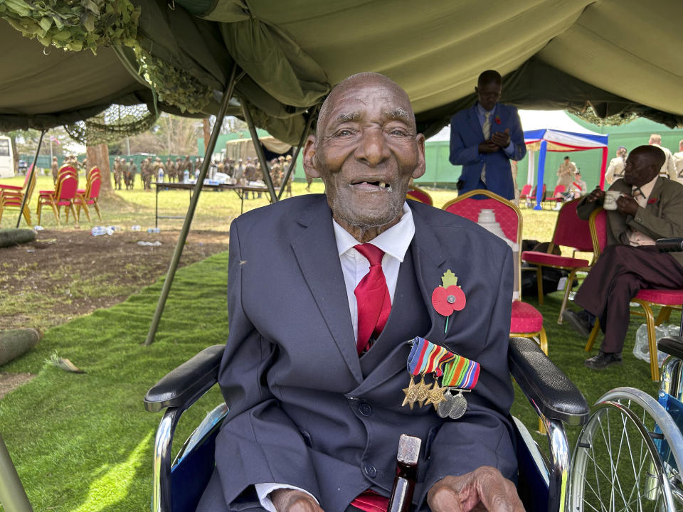 War veteran Samuel Mbuthia who claims to be 117 years old, poses for a photo, after he was awarded replacement medals by Britain's King Charles III, at the Commonwealth War Graves Commission cemetery, in Nairobi, Kenya, Wednesday, Nov. 1, 2023. King Charles III has visited a war cemetery in Kenya, laying a wreath in honor of Kenyans who fought alongside the British in the two world wars. It came a day after the British monarch expressed “greatest sorrow and the deepest regret” for the violence of the colonial era. He gave replacement medals to four war veterans. (AP Photo/Emmanuel Igunza)