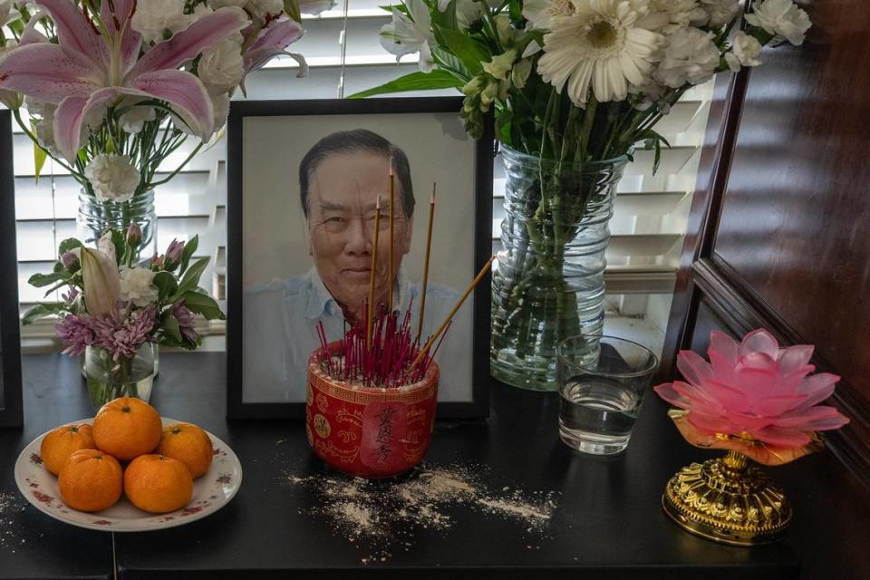 Incense burns near a portrait of Sau Voong, 84, along with offerings of fruit and water at one of his children’s homes in Natomas Park on July 8. The family said Voong taught them family traditions from the village they immigrated from in south China.