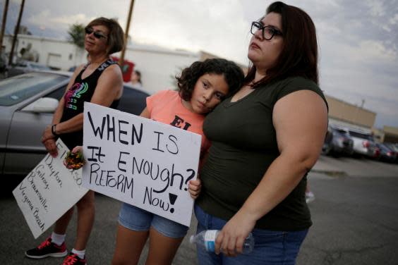 Families gather at the scene of the El Paso shooting as a chorus of calls for a US gun control clampdown grow louder (REUTERS)