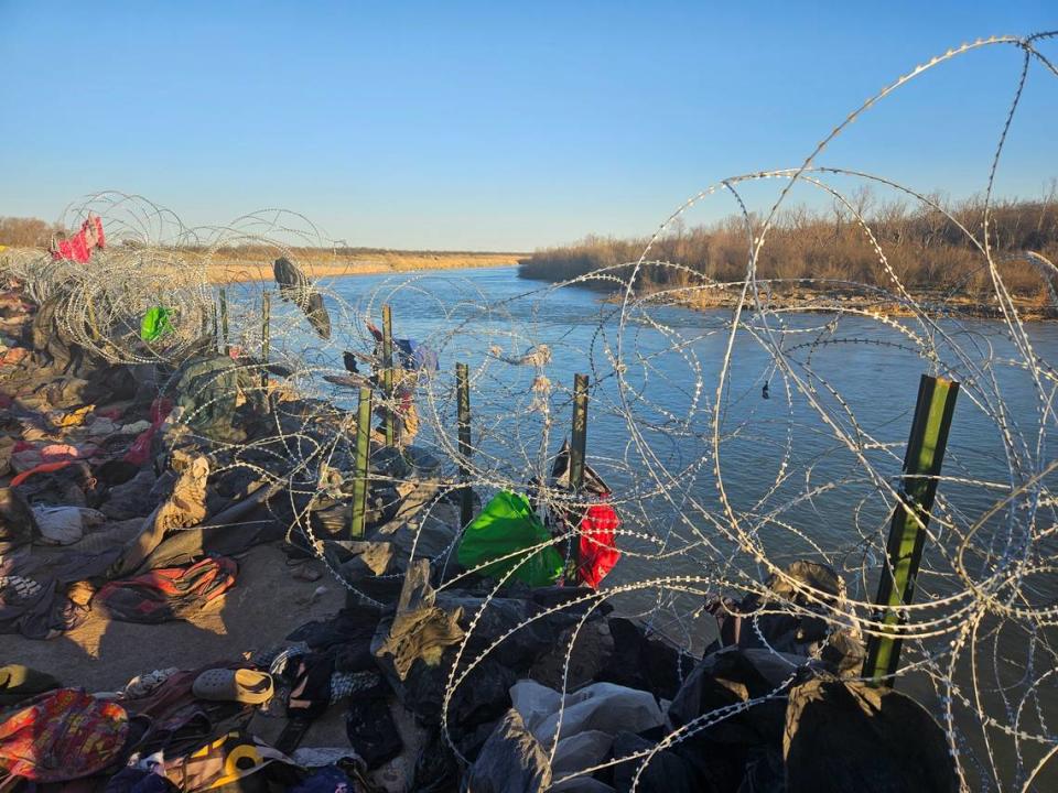 Migrants leave their wet clothes behind after swimming across the Rio Grande in Eagle Pass, Texas.