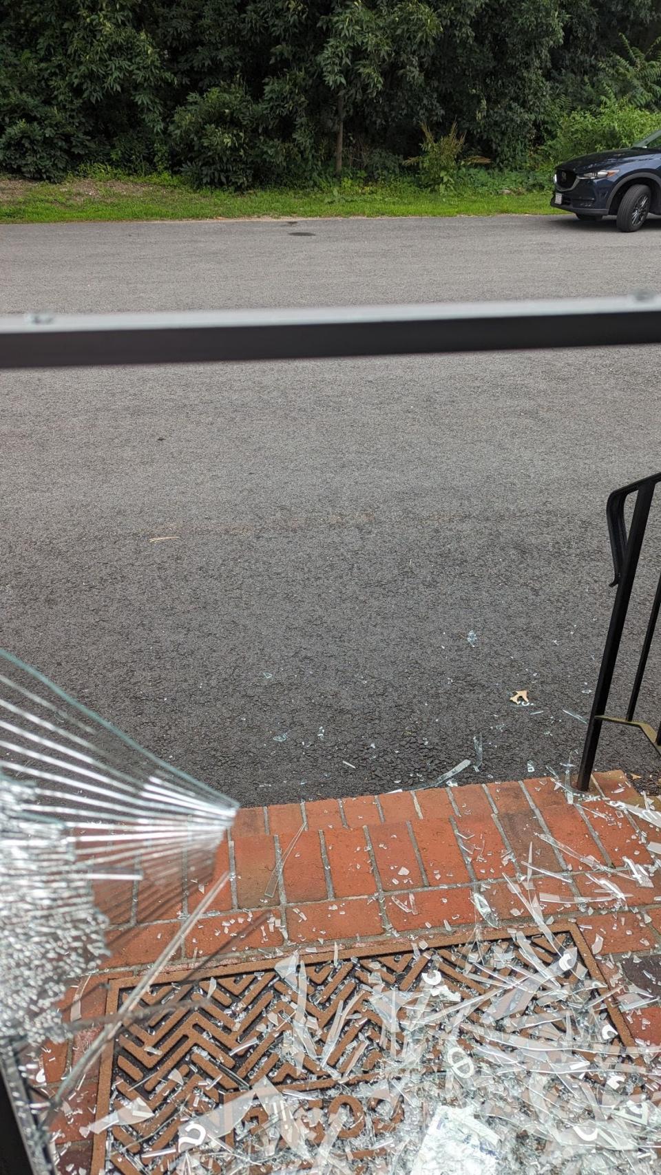 Glass from the front door of Gilbert's Sports Nostalgia in Natick after a break-in on Sunday.