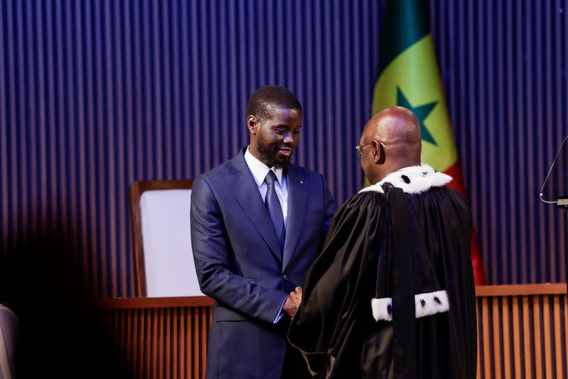 Senegal's Newly elected President Bassirou Diomaye Faye takes the oath of office as president during the inauguration ceremony in Dakar