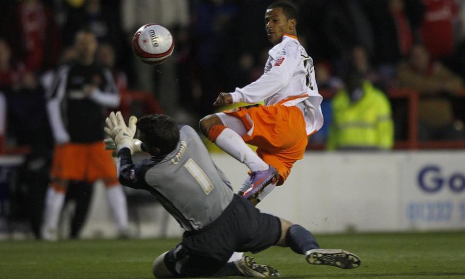 DJ Campbell scores Blackpool’s second goal in the first leg of the play-off semi-final.