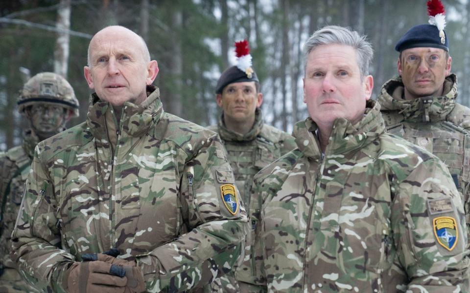 Shadow defence secretary John Healey on an earlier visit with Sir Keir Starmer