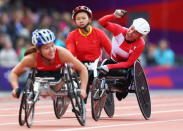 Edith Wolf of Switzerland celebrates winning gold in the Women's 5000m T54 Final on day 4 of the London 2012 Paralympic Games at Olympic Stadium on September 2, 2012 in London, England. (Photo by Michael Steele/Getty Images)