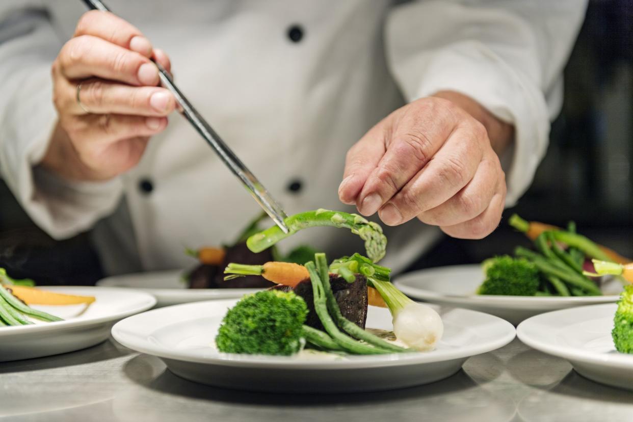 chef creating vegetable plate