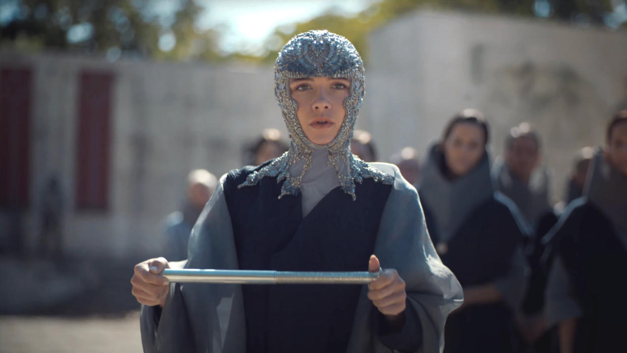  Florence Pugh holds a scroll with an expression of concern in Dune: Part Two. 