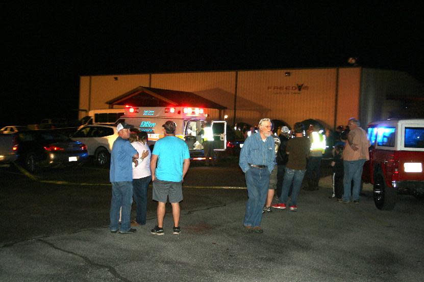 Emergency responders, members of Freedom Baptist Church, and Myrick community members in rural Jones County, Miss. gather outside Freedom Baptist Church Wednesday night after a second floor youth room collapsed onto a first floor kitchen. Up to 35 youth ages from seventh grade to 12th grade were injured. A 16-year-old girl who suffered a head injury was airlifted to Forrest General Hospital in Hattiesburg. (AP Photo/The Chronicle, Jason Niblett)