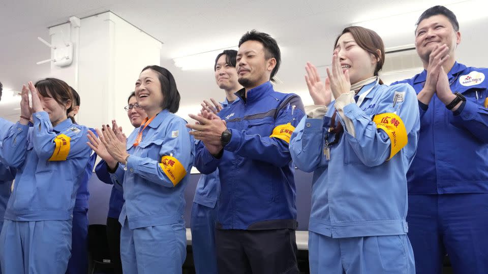 Officials of the Japan Aerospace Exploration Agency and Mitsubishi Heavy Industries Ltd. celebrate after two functioning microsatellites were detached from Japan's No. 2 H3 rocket following its lift-off from the Tanegashima Space Center in Minamitane, Kagoshima Prefecture, southwestern Japan, on Feb. 17, 2024. (Photo by Kyodo News via Getty Images) - Kyodo News/Getty Images