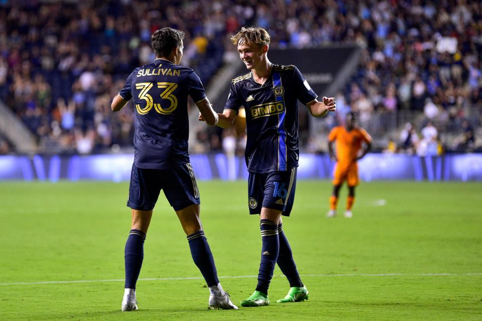 Philadelphia Union's Quinn Sullivan (33) celebrates with Jack McGlynn, right, after scoring a goal during the second half of an MLS soccer match against the Houston Dynamo, Saturday, July 30, 2022, in Chester, Pa.