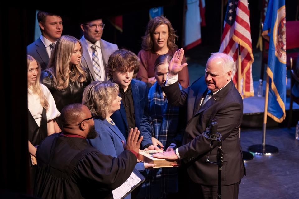 Minnesota Gov. Tim Walz is sworn in by Judge Johnathan Judd in St. Paul, Minn., on Jan. 2, 2023.