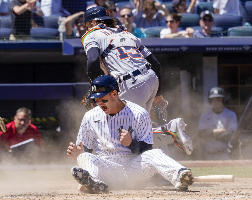 New York Yankees' Anthony Rizzo reacts after sliding into home base and scoring off an error to tie a baseball game in the eighth inning against the Detroit Tigers, Sunday, June 5, 2022, in New York. (AP Photo/Mary Altaffer)