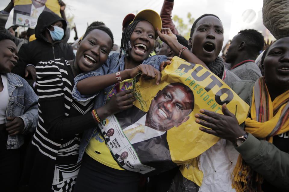 Supporters of Deputy President and presidential candidate William Ruto celebrate his victory over opposition leader Raila Odinga in Eldoret, Kenya, Monday, Aug. 15, 2022. Ruto received 50.49% of the vote, the chairman of the electoral commission said, while Odinga received 48.85%. (AP Photo/Brian Inganga)