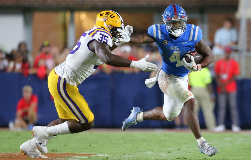 Sep 30, 2023; Oxford, Mississippi, USA; Mississippi Rebels running back Quinshon Judkins (4) runs the ball as LSU Tigers defensive linemen Sai’vion Jones (35) attempts to make the tackle during the second half at Vaught-Hemingway Stadium. Mandatory Credit: Petre Thomas-USA TODAY Sports