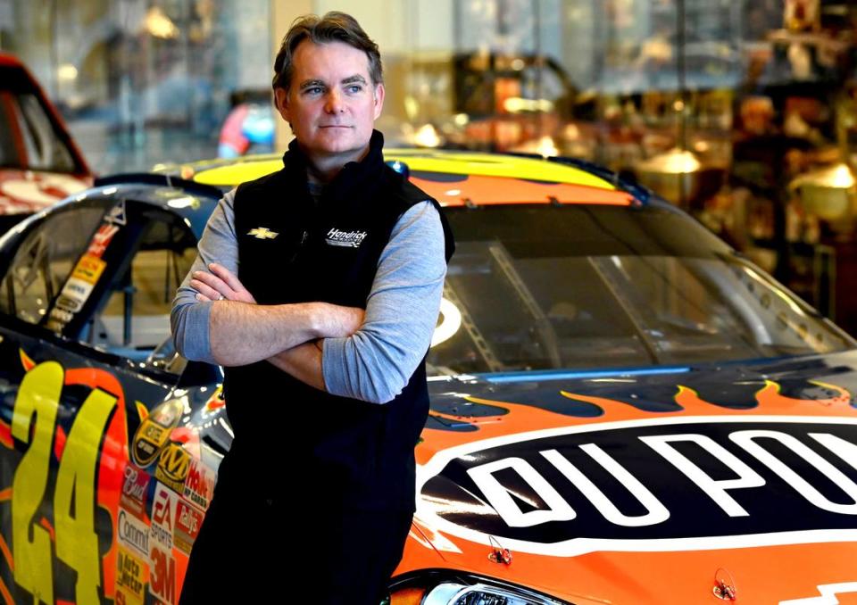 Former NASCAR driver and Hall of Fame member Jeff Gordon poses with one of his iconic No. 24 DuPont Chevrolets on Tuesday, March 21, 2023. Gordon is now the Vice-Chairman for Hendrick Motorsports in Concord, NC.