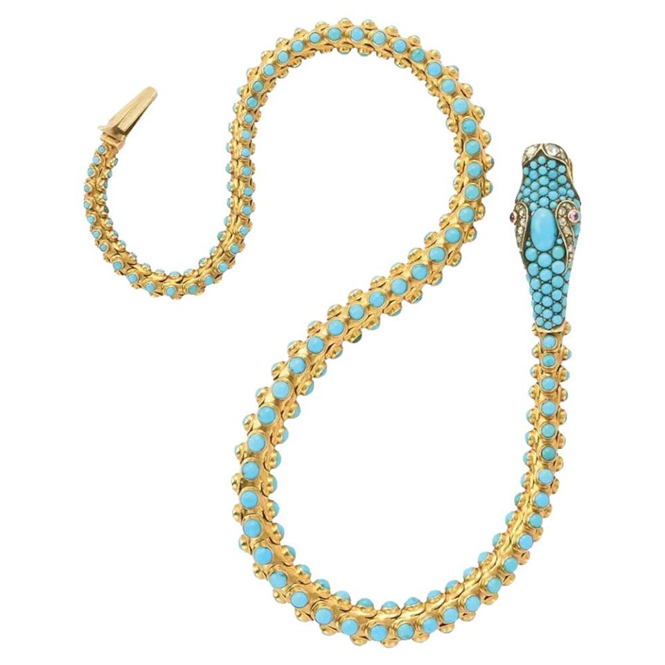 This circa-1860 serpent necklace of British origin is crafted of 15-karat articulated yellow gold embellished with cabochon-cut turquoise and rose-cut diamonds and rubies; approximately $35,000, at 1stdibs.com