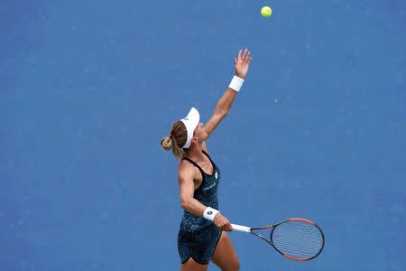 Aug 15, 2018; Mason, OH, USA; Lesia Tsurenko (UKR) serves against Garbine Muguruza (ESP) in the Western and Southern Tennis Open at Lindner Family Tennis Center. Mandatory Credit: Aaron Doster-USA TODAY Sports