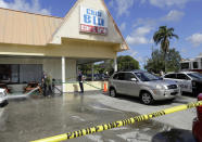 <p>Fort Myers fire fighters hose down the pavement at the scene of a deadly shooting outside the Club Blu nightclub in Fort Myers, Fla., Monday, July 25, 2016. (AP Photo/Lynne Sladky)</p>