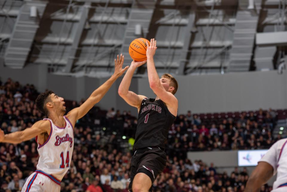 Bradley Braves forward Malevy Leons defends against SIU star Marcus Domask in the waning moments of BU's 50-48 win over Southern Illinois at Banterra Center in Carbondale on Sunday, Feb. 19, 2023.