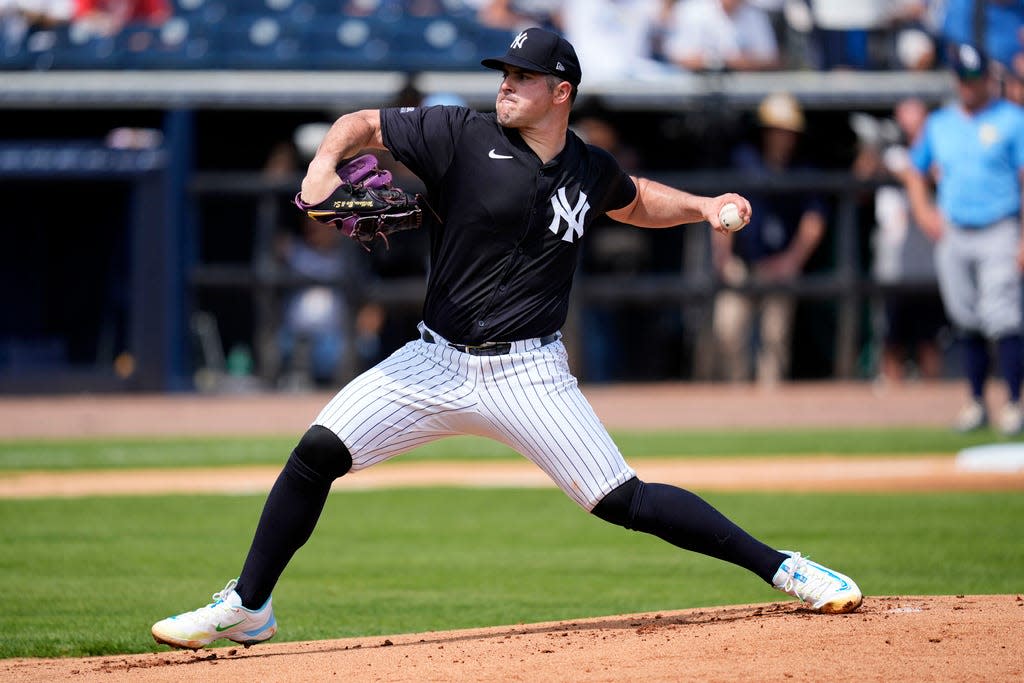 New York Yankees starting pitcher Carlos Rodon throws during there first inning of a spring training baseball game against the Tampa Bay Rays Wednesday, March 6, 2024, in Tampa, Fla. (AP Photo/Charlie Neibergall)
