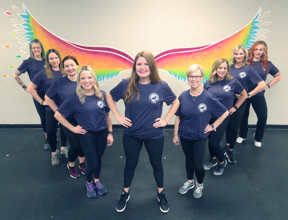 Tyrannosaurus Flex Fitness staff members from left, Angie Carpenter, Sandy Davis, Becky O'Grace, Megan Leet, owner Kellie Dziemianzuk, Sandy Triplett, Christine Cherkala, Jennifer Stancil and Amanda McKenzie on Thursday in Stow.