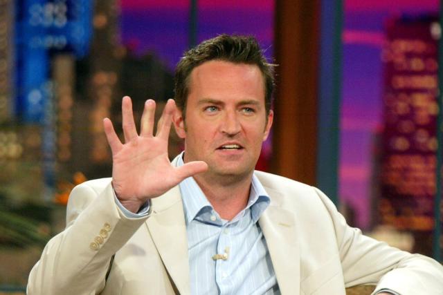 Grieving fans flock to 'Friends' New York apartment to mourn Matthew Perry