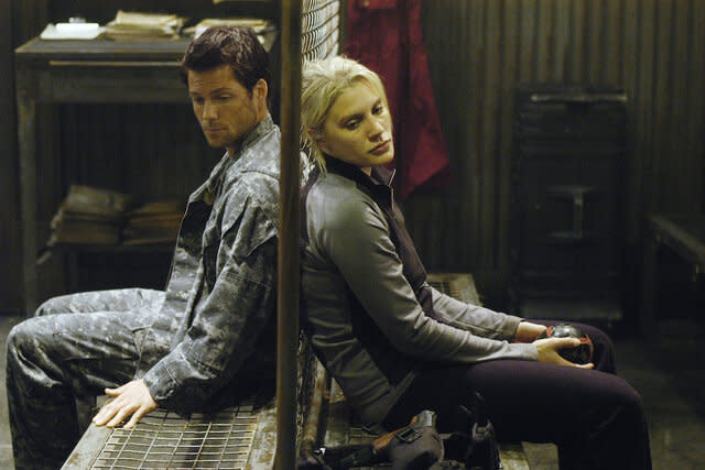 (l-r) Jamie Bamber as Captain Lee 'Apollo' Adama, Katee Sackhoff as Lieutenant Kara 'Starbuck' Thrace in BATTLESTAR GALACTICA