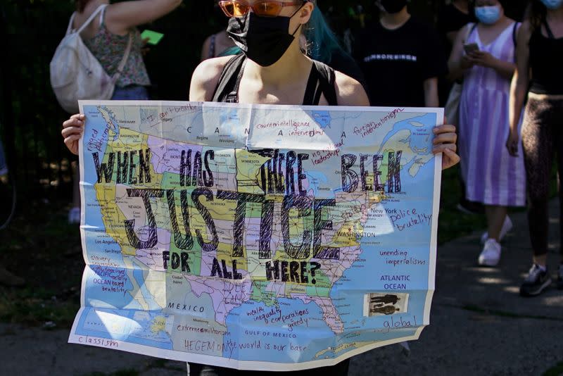 Protesters rally against the death in Minneapolis police custody of Floyd, in the Brooklyn borough of New York City