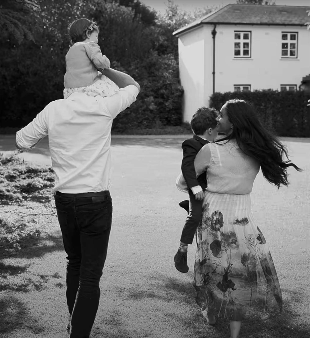 Lilbet on the shoulders of her father, Prince Harry, walking along side mom Meghan Markle and brother Archie. (Netflix)