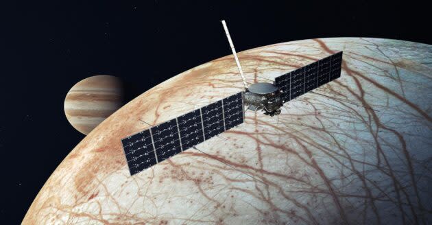 An artist’s conception shows NASA’s Europa Clipper probe flying over Europa. (NASA / JPL-Caltech Illustration)