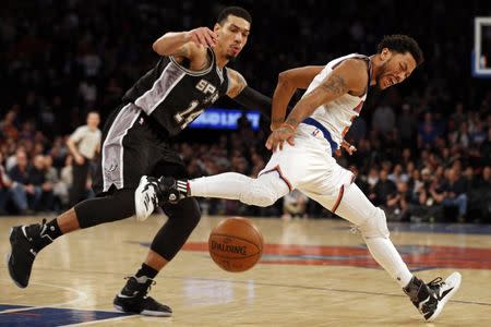 Feb 12, 2017; New York, NY, USA; New York Knicks guard Derrick Rose (25) reacts after being fouled by San Antonio Spurs guard Danny Green (14) during the second half at Madison Square Garden. Mandatory Credit: Adam Hunger-USA TODAY Sports