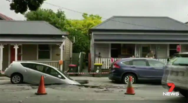 The Toyota stuck in the sinkhole. Source: 7News