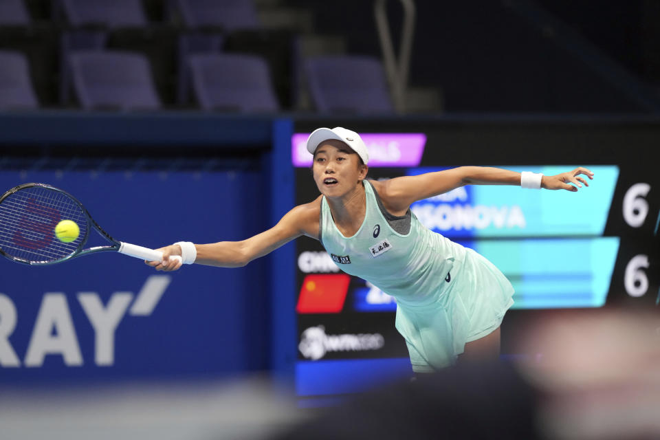 Zhang Shuai of China leaps for a ball to return against Liudmila Samsonova of Russia during a singles semifinal match in the Pan Pacific Open tennis championships at Ariake Colosseum Saturday, Sept. 24, 2022, in Tokyo. (AP Photo/Eugene Hoshiko)