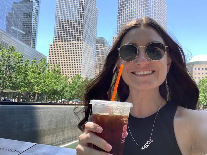 The author takes a selfie with a cold brew from Dunkin' Donuts.