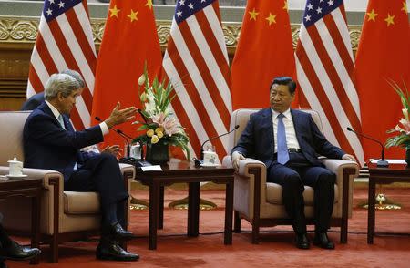 U.S. Secretary of State John Kerry meets with China's President Xi Jinping (R) at the Great Hall of the People in Beijing July 10, 2014. REUTERS/Jim Bourg